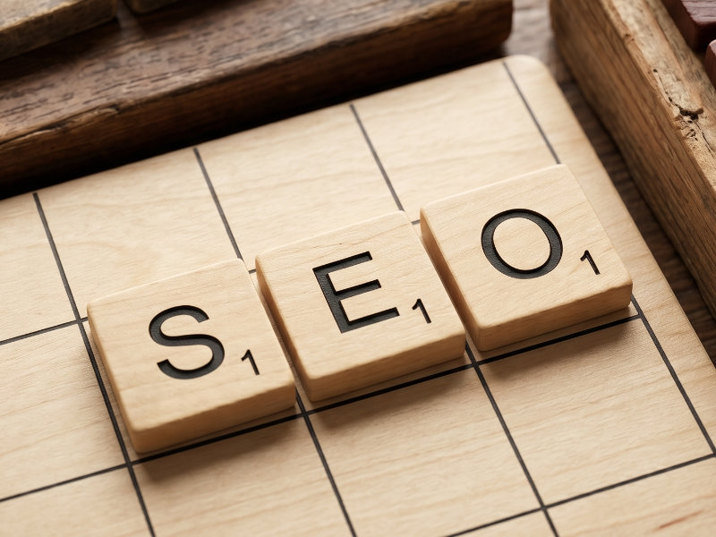 An AI generated image showing the term SEO spelled out using wooden letter tiles.